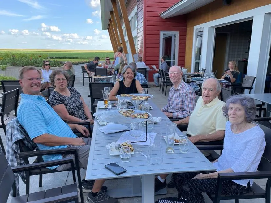 Adela, Howland and Bahnemann families enjoying wine and pizza at Four Daughters Vineyard & Winery in Spring Valley, MN (Summer 2022).